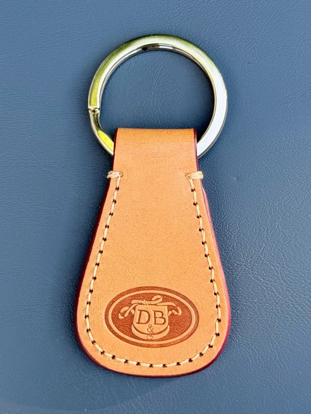 Dooney & Bourke Embossed Logo Tan Leather Strap Key Fob